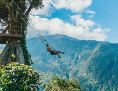 girl on a swing over a cliff