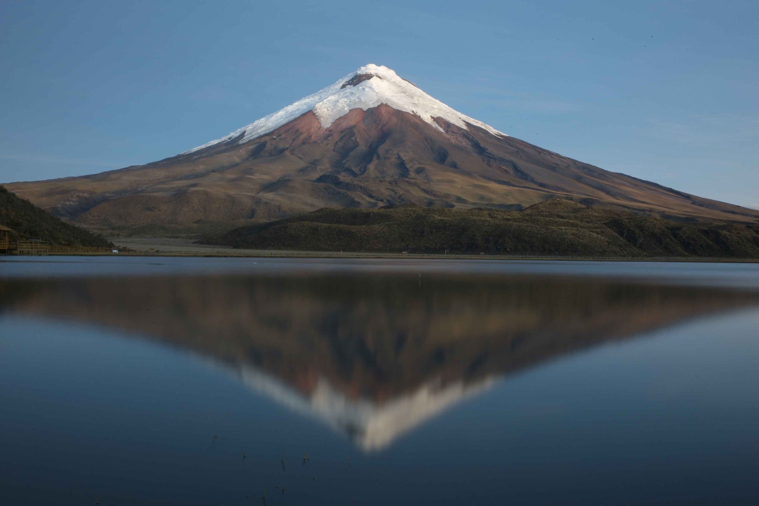 Cotopaxi volcano Ecuador with reflection on lake